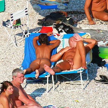 Girls beach bikini showing off tits