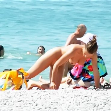 Young nudist boys on beach